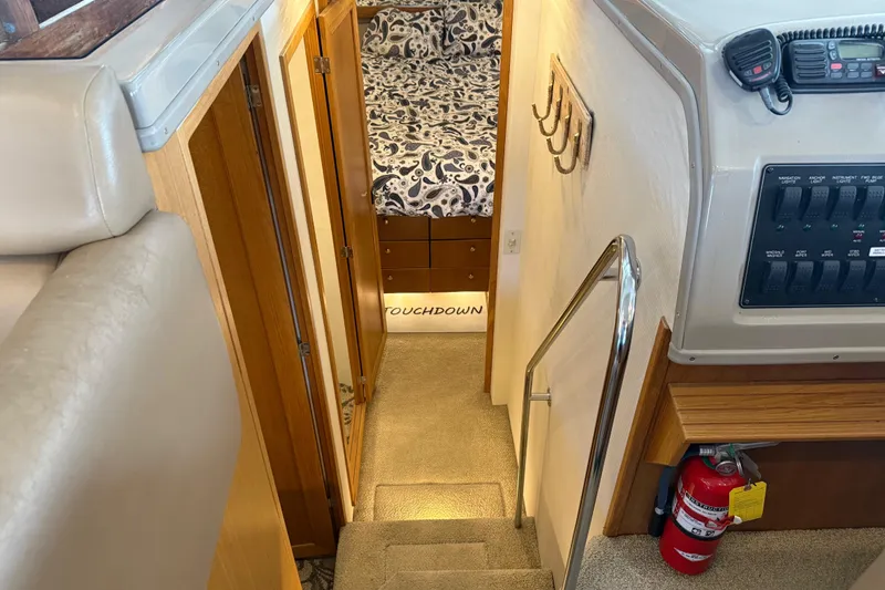 Slide: The Image of Interior of 2000 Bayliner 3988 Command Bridge Motoryacht, showing stairs and cabin entrance. - 26