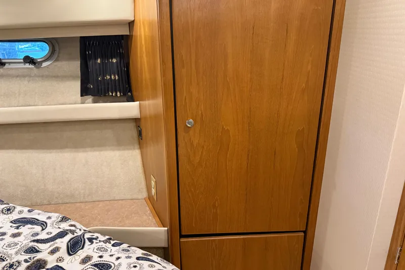 Slide: The Image of Interior cabin of 2000 Bayliner 3988 Command Bridge Motoryacht with wood paneling and window. - 29