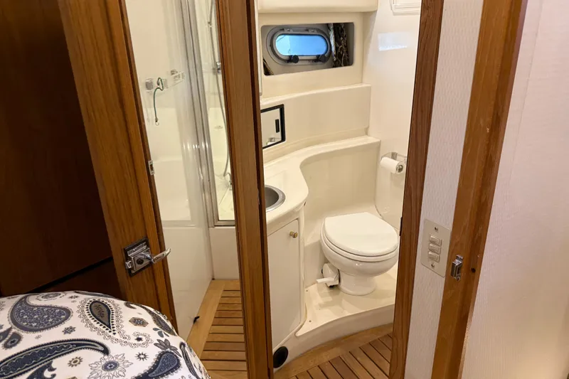 Slide: The Image of Bathroom interior of 2000 Bayliner 3988 Command Bridge Motoryacht with wooden accents. - 36