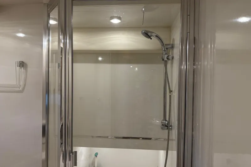 Slide: The Image of Shower area in 2000 Bayliner 3988 Command Bridge Motoryacht with glass door and chrome fixtures. - 38