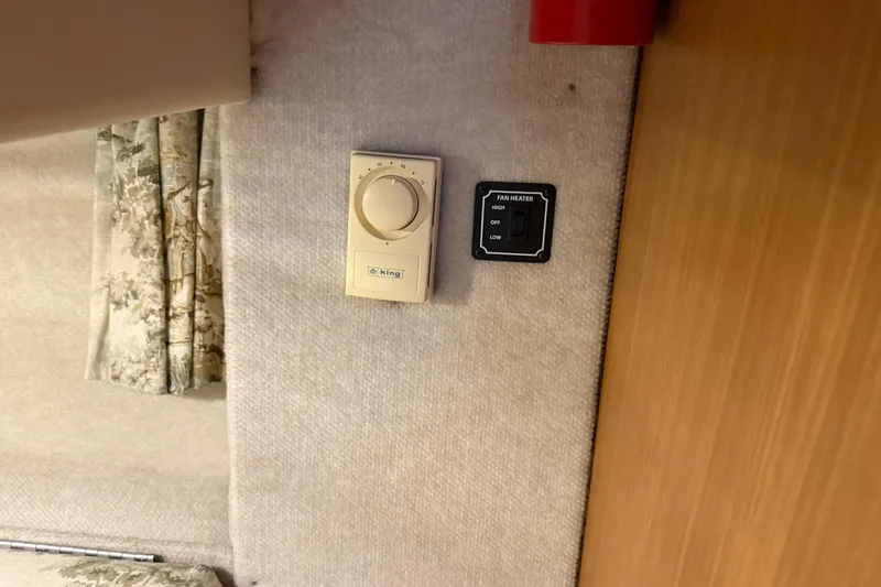 Slide: The Image of Thermostat and fan heater controls on 2000 Bayliner 3988 Command Bridge Motoryacht interior. - 43