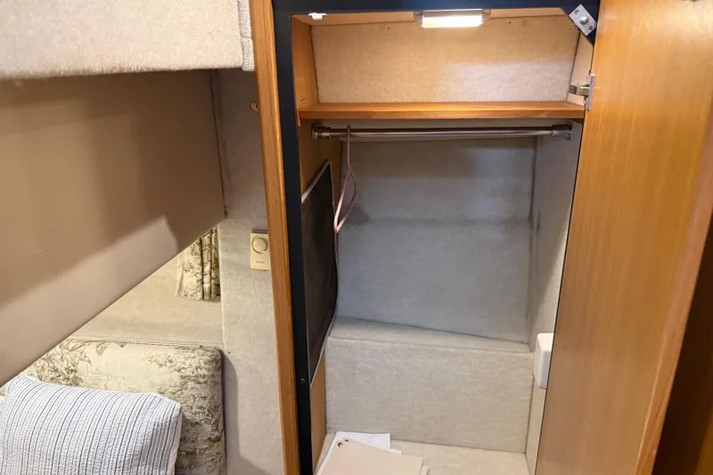 Slide: The Image of Interior of 2000 Bayliner 3988 Command Bridge Motoryacht showing closet and seating area. - 44