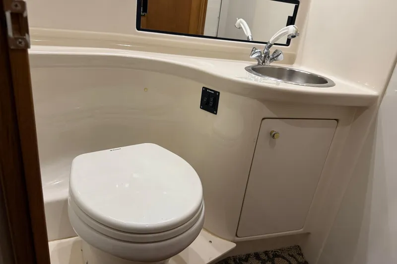 Slide: The Image of Bathroom interior of 2000 Bayliner 3988 Command Bridge Motoryacht with toilet and sink. - 47