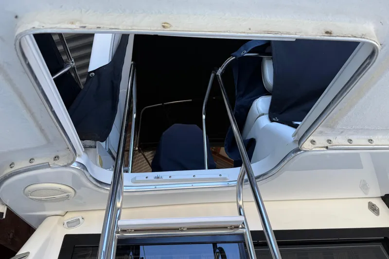 Slide: The Image of 2000 Bayliner 3988 Command Bridge Motoryacht interior view with ladder and seating. - 51