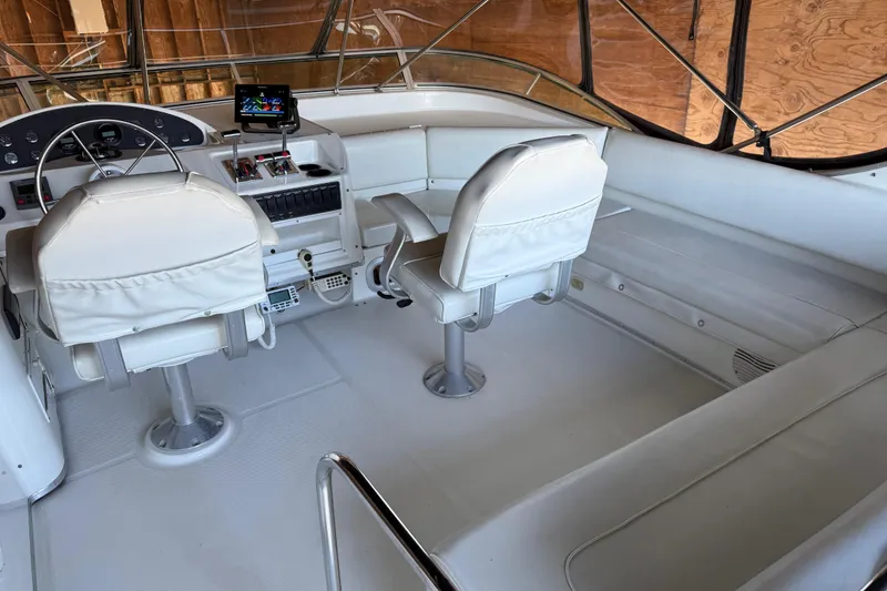 Slide: The Image of 2000 Bayliner 3988 Command Bridge Motoryacht interior with helm and seating area. - 53