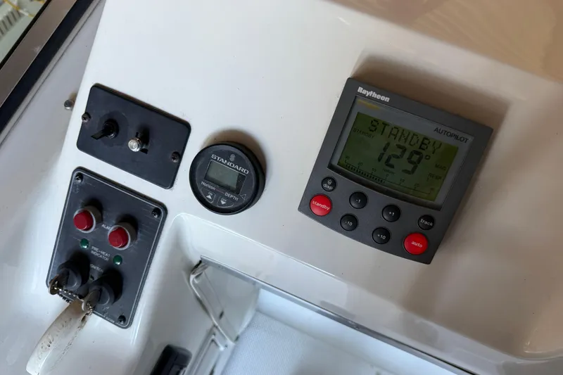 Slide: The Image of Control panel of a 2000 Bayliner 3988 Command Bridge Motoryacht with autopilot display. - 60