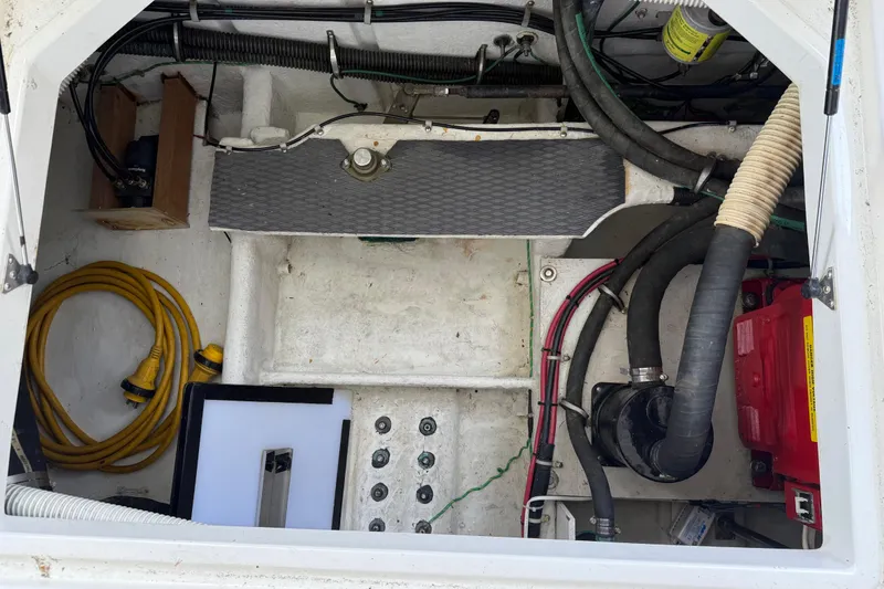Slide: The Image of Engine compartment of 2000 Bayliner 3988 Command Bridge Motoryacht with cables and equipment. - 72