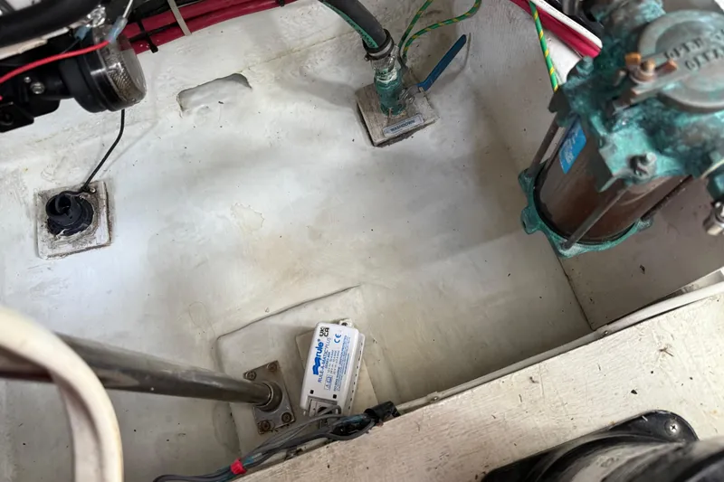 Slide: The Image of Engine compartment of 2000 Bayliner 3988 Command Bridge Motoryacht, showing mechanical components. - 73