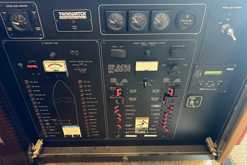 Slide: The Image of Control panel of a 2000 Bayliner 3988 Command Bridge Motoryacht with gauges and switches. - 8