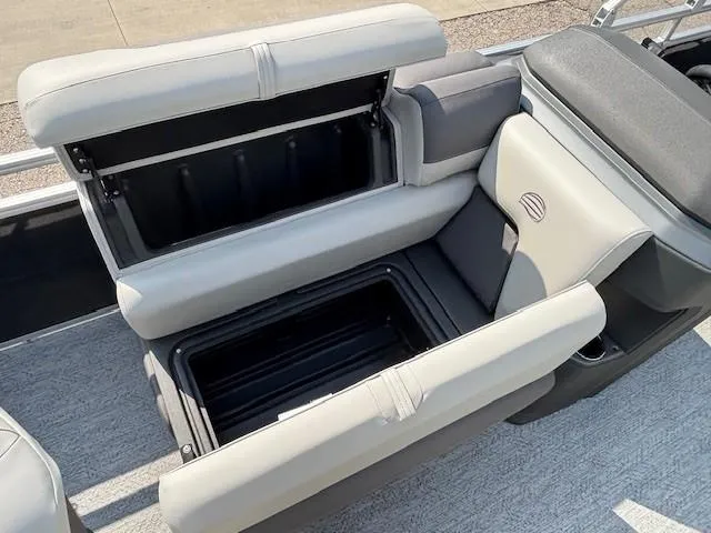 Slide: The Image of 2026 Sun Tracker Fishin' Barge 20 DLX boat seat with open storage compartment. - 15