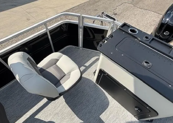 Slide: The Image of 2026 Sun Tracker Fishin' Barge 20 DLX interior with seating and fishing station. - 24