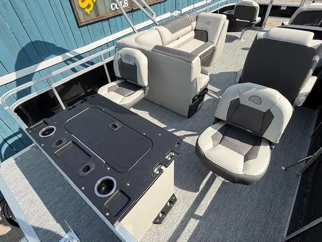 Slide: The Image of 2026 Sun Tracker Fishin' Barge 20 DLX interior with seating and fishing station. - 27