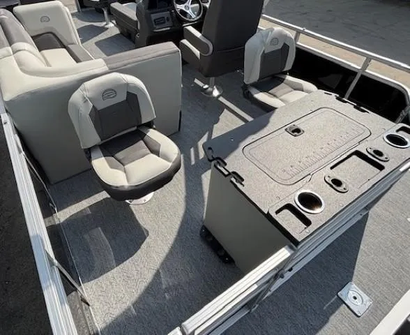 Slide: The Image of 2026 Sun Tracker Fishin' Barge 20 DLX interior with seating and fishing station. - 28