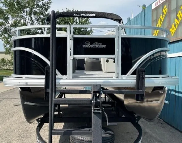 Slide: The Image of 2026 Sun Tracker Fishin' Barge 20 DLX pontoon boat on trailer, rear view. - 3