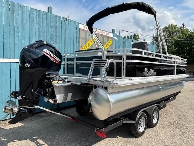Slide: The Image of 2026 Sun Tracker Fishin' Barge 20 DLX pontoon boat with Mercury outboard motor. - 4