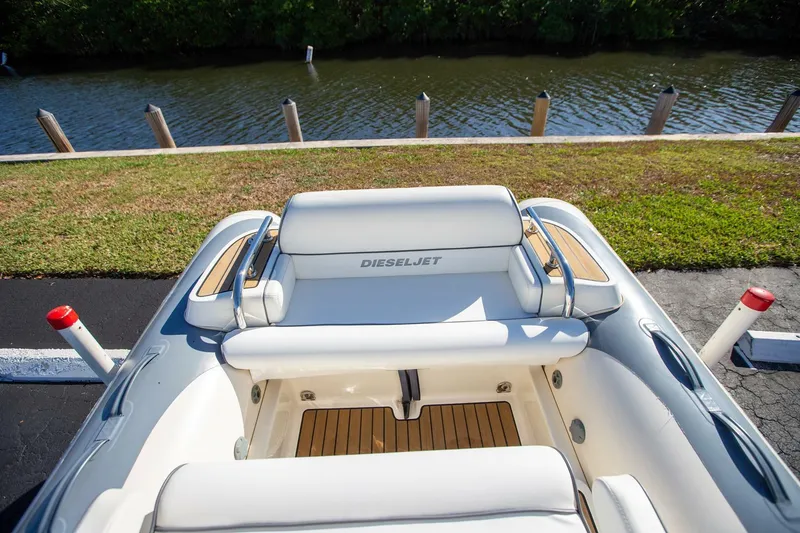 Slide: The Image of 2018 Williams Jet Tenders 505 Dieseljet boat interior by the water. - 10