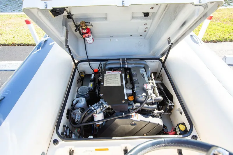 Slide: The Image of Open engine compartment of 2018 Williams Jet Tenders 505 Dieseljet, showcasing engine components. - 11