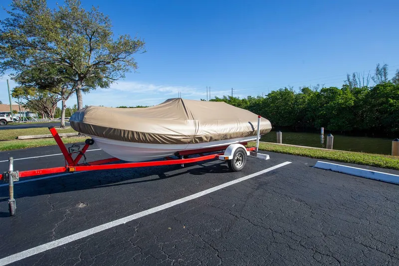 Slide: The Image of 2018 Williams Jet Tenders 505 Dieseljet covered on trailer in parking lot. - 2