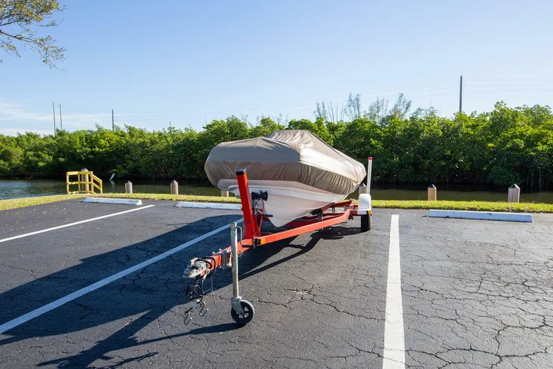 Slide: The Image of 2018 Williams Jet Tenders 505 Dieseljet on trailer, covered, in parking lot. - 3