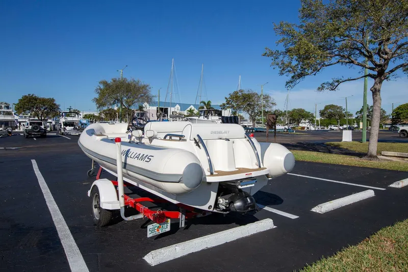 Slide: The Image of 2018 Williams Jet Tenders 505 Dieseljet on trailer in parking lot, clear sky background. - 5