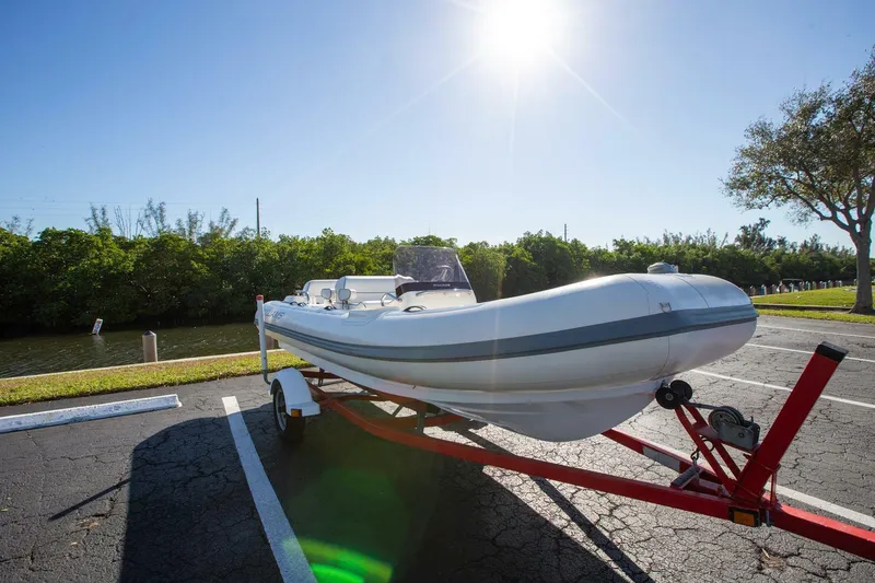 Slide: The Image of 2018 Williams Jet Tenders 505 Dieseljet on trailer under bright sun. - 6