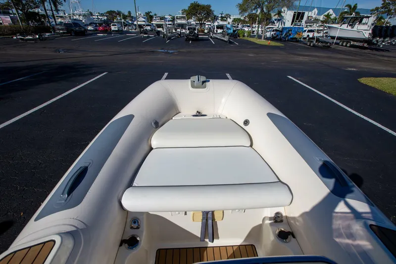 Slide: The Image of 2018 Williams Jet Tenders 505 Dieseljet boat in a parking lot, showcasing seating area. - 7