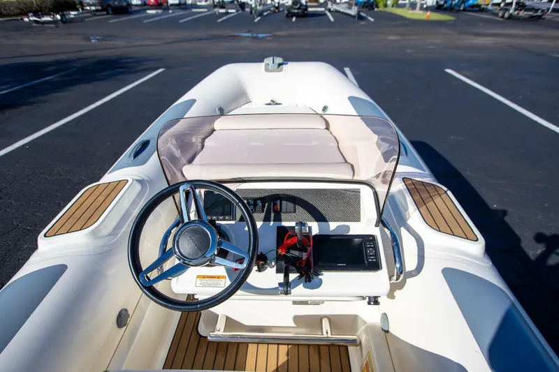Slide: The Image of 2018 Williams Jet Tenders 505 Dieseljet dashboard with steering wheel and controls. - 8