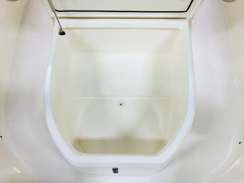 Slide: The Image of 2026 Scout 215 XSF boat storage compartment, open and empty. - 10