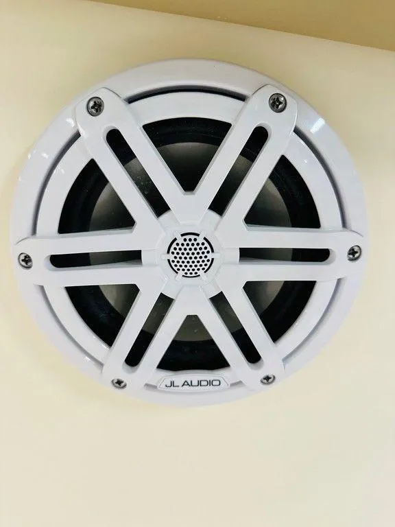 Slide: The Image of White JL Audio speaker on 2026 Scout 215 XSF boat. - 11