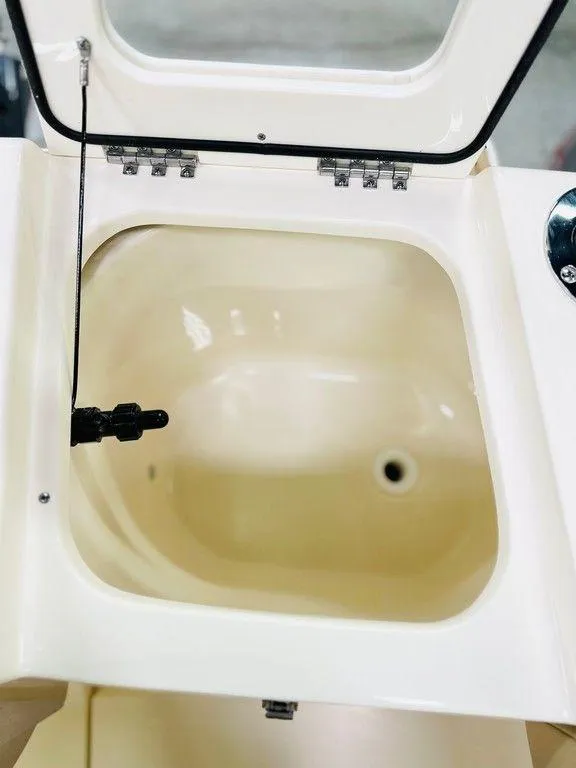 Slide: The Image of Open compartment of 2026 Scout 215 XSF boat, showcasing interior details. - 15