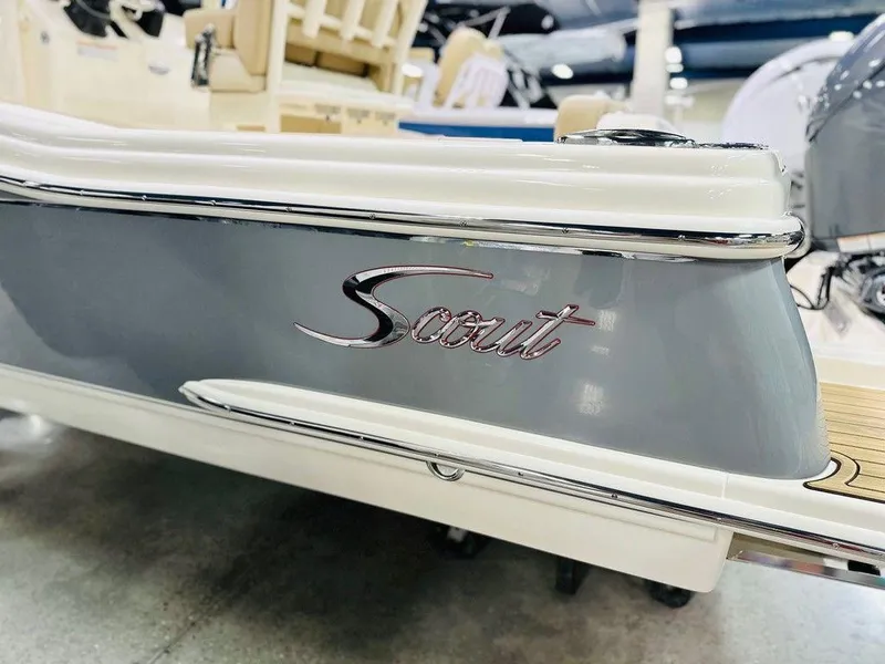Slide: The Image of 2026 Scout 215 XSF boat, sleek design with chrome accents. - 17