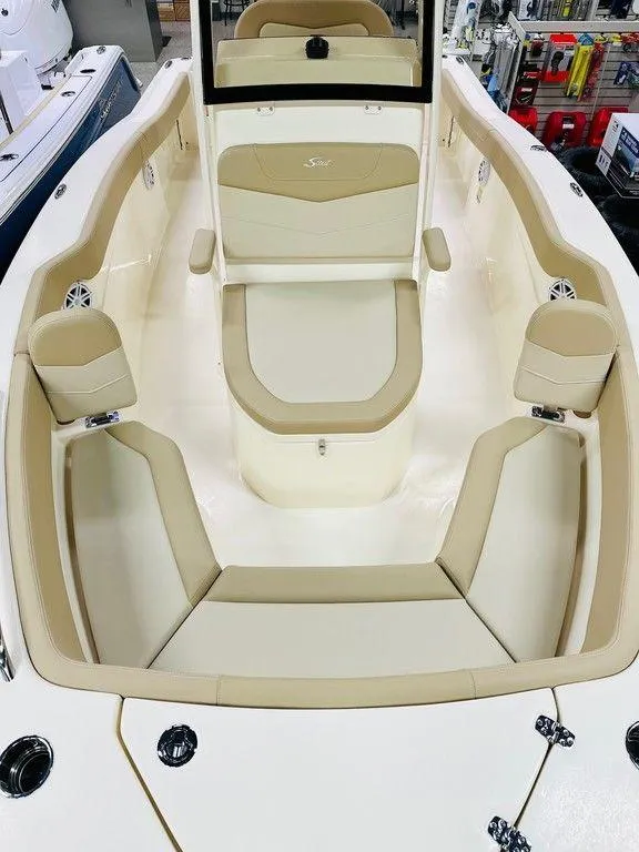Slide: The Image of 2026 Scout 215 XSF boat interior with beige seating and modern design. - 6