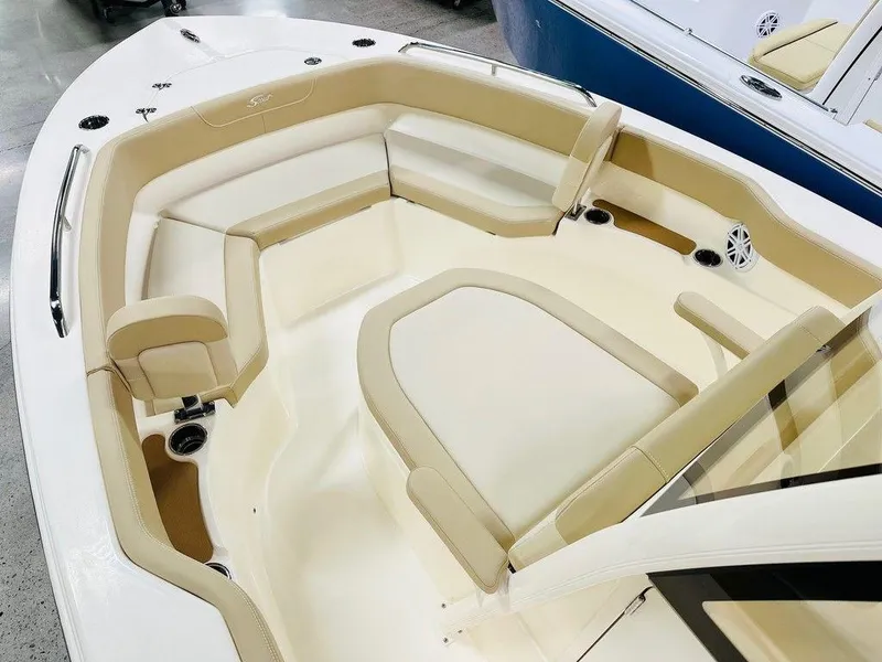 Slide: The Image of 2026 Scout 215 XSF boat interior with beige seating and modern design. - 8
