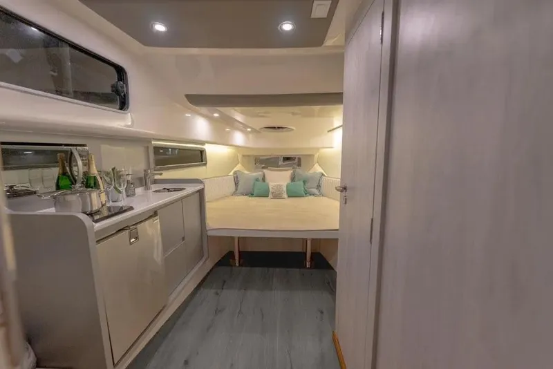 Slide: The Image of Luxurious interior of 2025 Hanover 387 yacht with cozy bed and kitchenette. - 15