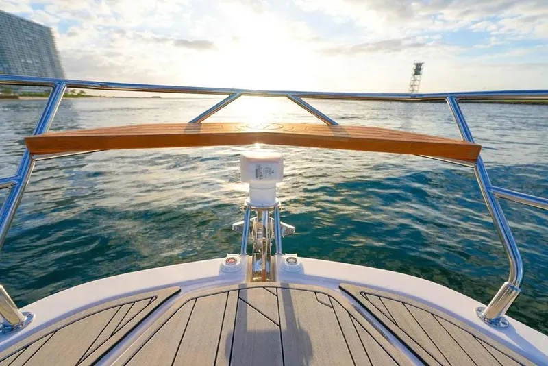 Slide: The Image of Bow view of 2025 Hanover 387 yacht on water at sunset. - 17