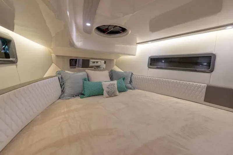 Slide: The Image of Luxurious interior cabin of 2025 Hanover 387 yacht with plush bedding and ambient lighting. - 18