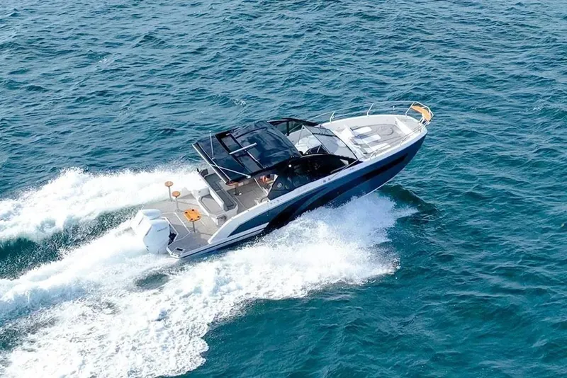 Slide: The Image of 2025 Hanover 387 boat cruising on open sea, creating white waves. - 4