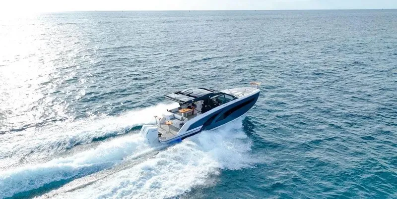 Slide: The Image of 2025 Hanover 387 yacht cruising on open sea, creating waves. - 8