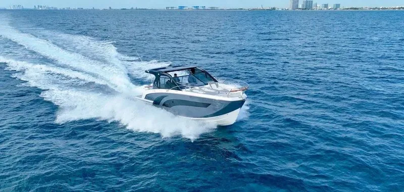 Slide: The Image of 2025 Hanover 387 boat cruising on open blue ocean waters. - 9