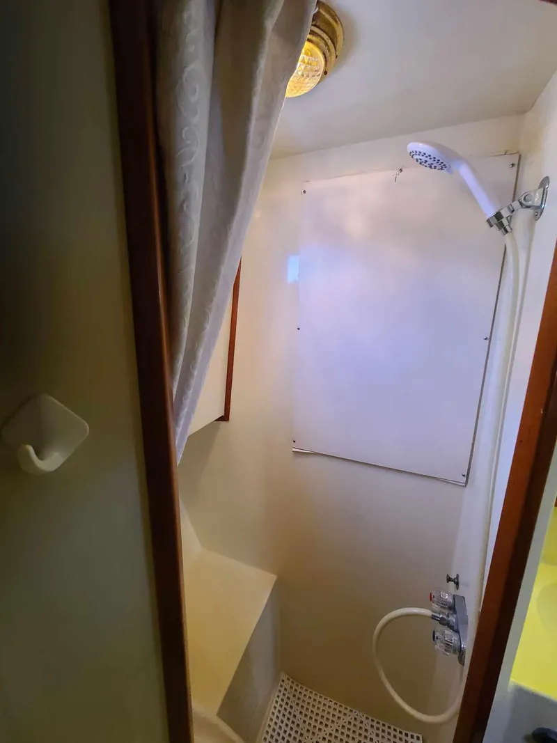 Slide: The Image of Compact shower area in 1989 Eagle 32 Trawler boat. - 24