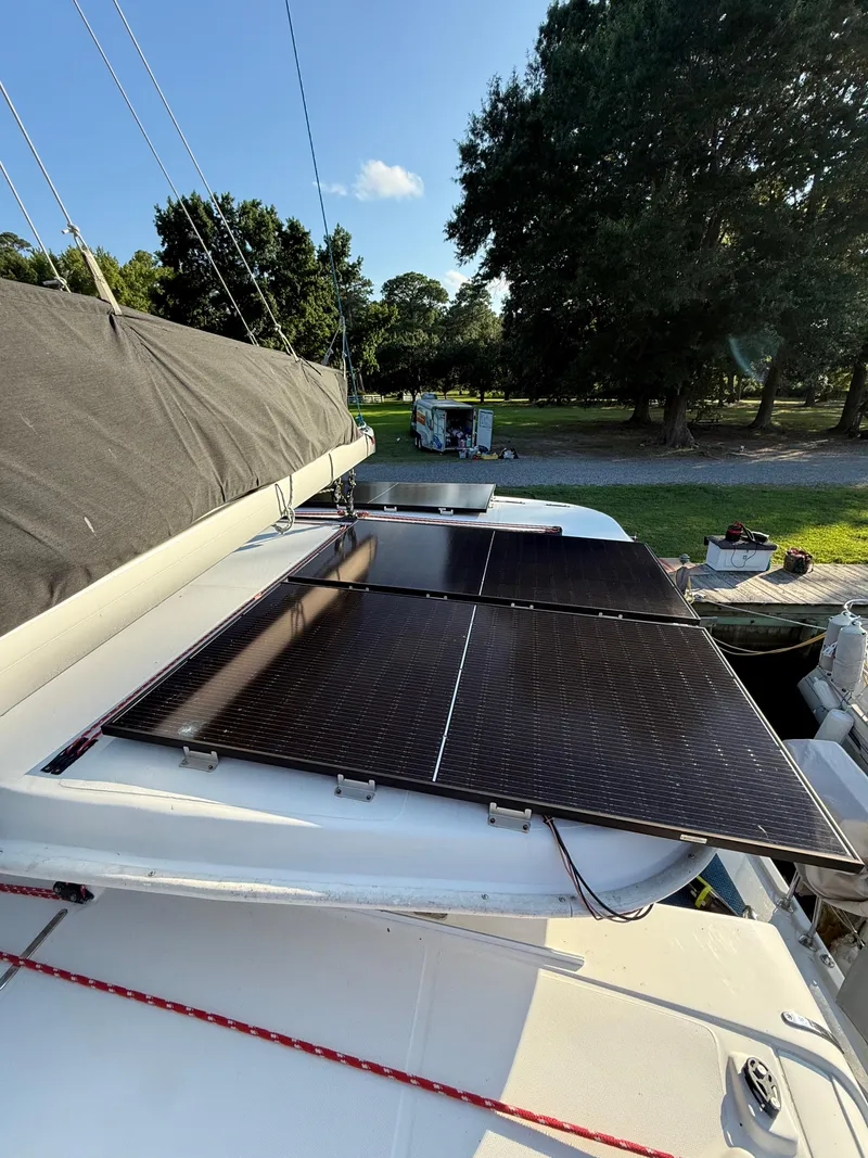 Slide: The Image of Solar panels on a 2010 Leopard 38 catamaran under clear blue sky. - 21