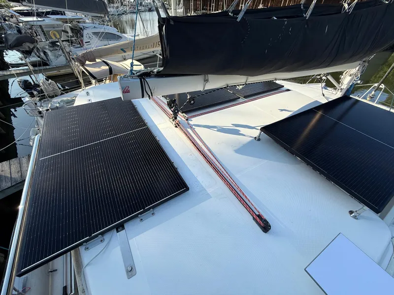 Slide: The Image of Solar panels on a 2010 Leopard 38 catamaran deck in a marina. - 23