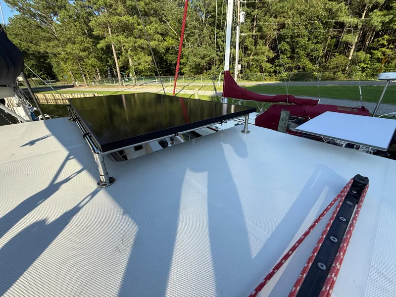 Slide: The Image of Sailboat deck with solar panel, Leopard 38, 2010 model, surrounded by trees. - 24