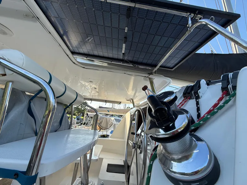 Slide: The Image of Interior view of a 2010 Leopard 38 catamaran with solar panels and steering wheel. - 25