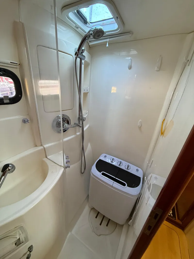Slide: The Image of Compact bathroom in 2010 Leopard 38 yacht with shower and washing machine. - 4