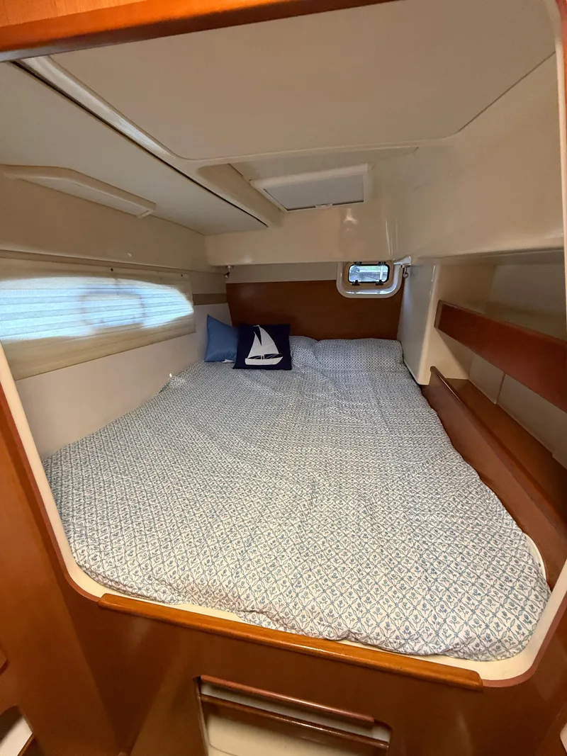 Slide: The Image of Cozy cabin bed in 2010 Leopard 38 yacht with nautical-themed decor. - 6