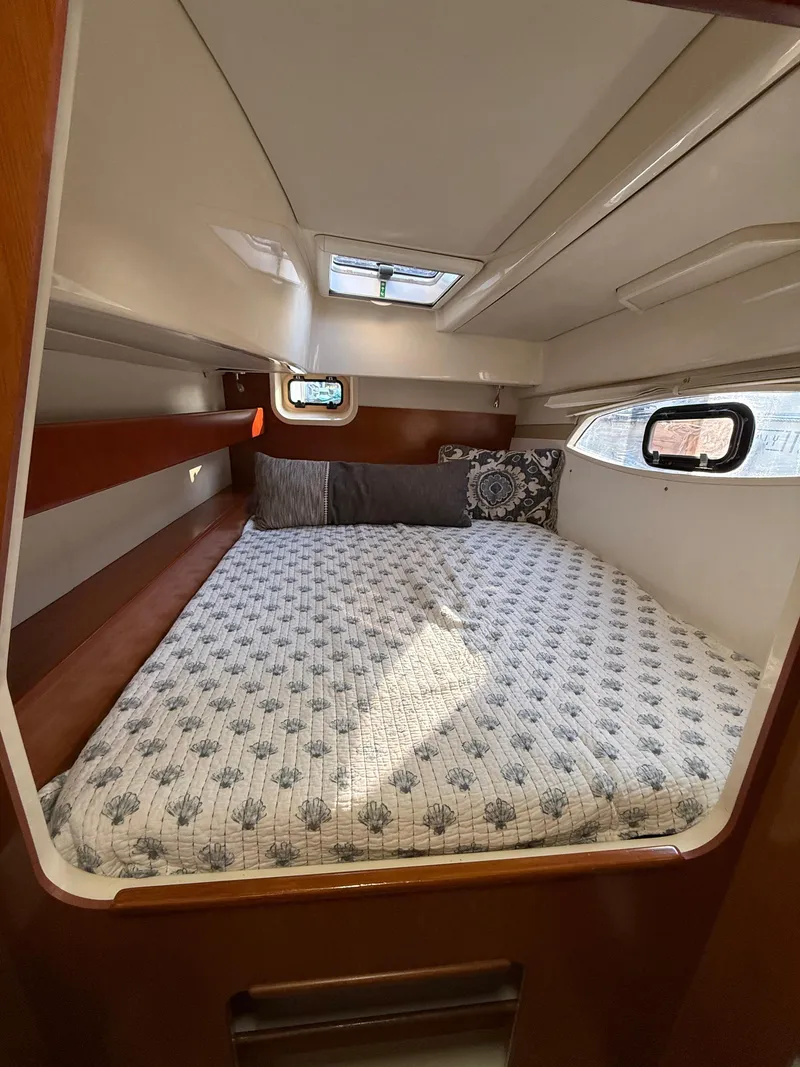 Slide: The Image of Cozy cabin interior of 2010 Leopard 38 yacht with comfortable bedding. - 9