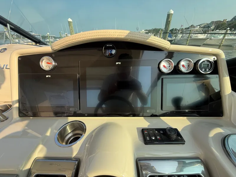 Slide: The Image of 2024 Formula 350 Crossover Bowrider dashboard with modern controls and navigation displays. - 10