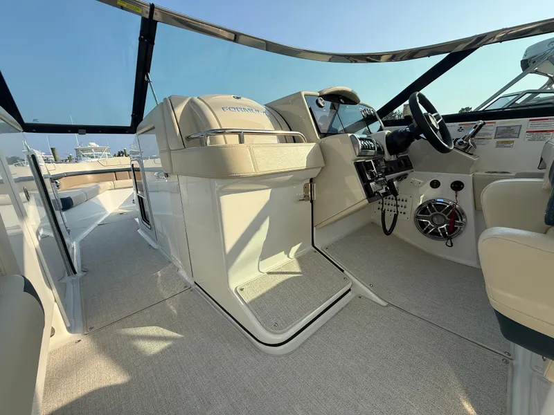 Slide: The Image of 2024 Formula 350 Crossover Bowrider interior with helm, seating, and modern controls. - 15