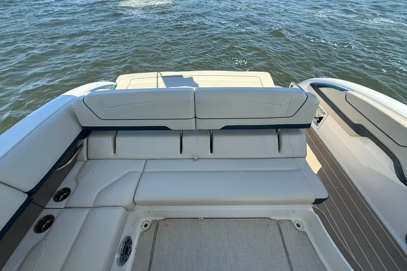 Slide: The Image of 2024 Formula 350 Crossover Bowrider with luxurious seating on open water. - 2